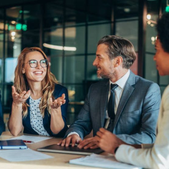 Group of business persons in business meeting. Group of entrepreneurs on meeting in board room. Corporate business team on meeting in the office. Multiracial group of business people having discussion